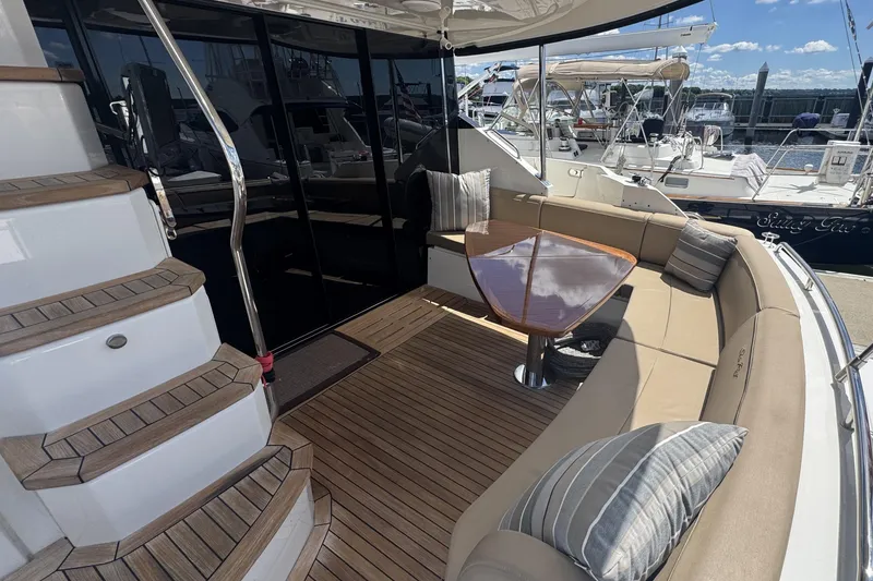 Slide: The Image of Luxurious bedroom interior of 2016 Sea Ray L590 Fly yacht with plush bedding. - 35