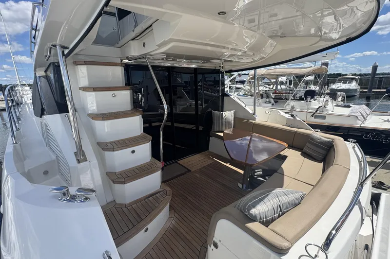 Slide: The Image of Luxurious cabin interior of 2016 Sea Ray L590 Fly yacht with twin beds and modern decor. - 37