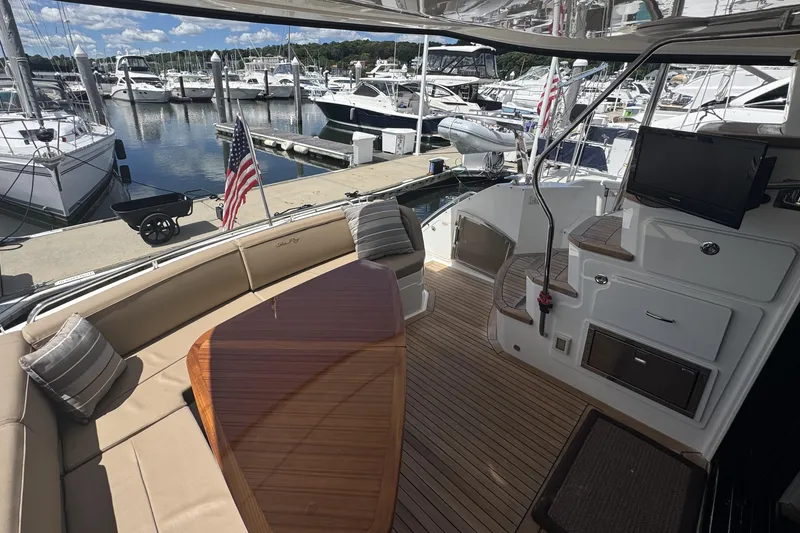 Slide: The Image of Luxurious 2016 Sea Ray L590 Fly yacht bedroom with modern decor and ambient lighting. - 38