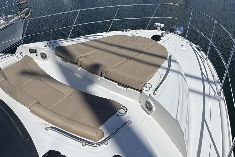 Slide: The Image of Luxurious 2016 Sea Ray L590 Fly yacht deck with cushioned sunbathing area. - 42