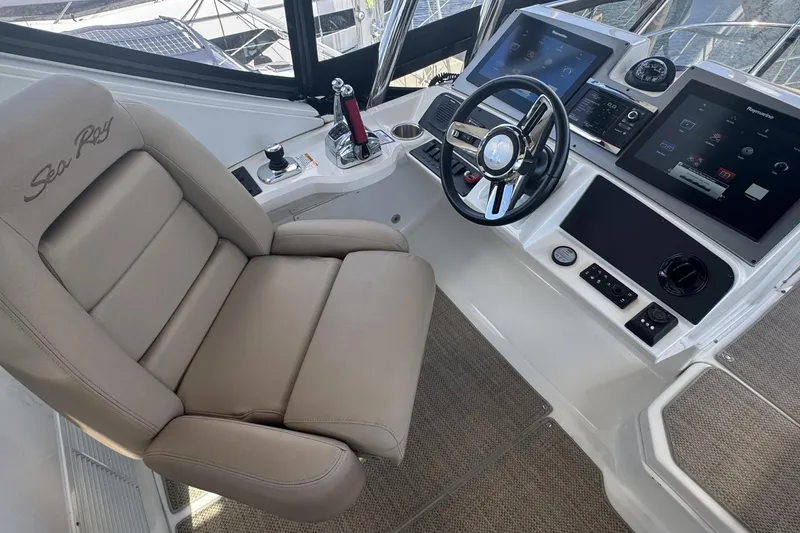 Slide: The Image of Engine room of a 2016 Sea Ray L590 Fly yacht, showcasing mechanical components. - 49