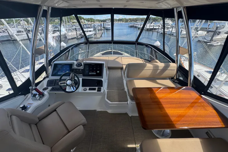 Slide: The Image of Engine room of a 2016 Sea Ray L590 Fly yacht, showcasing mechanical components and systems. - 50