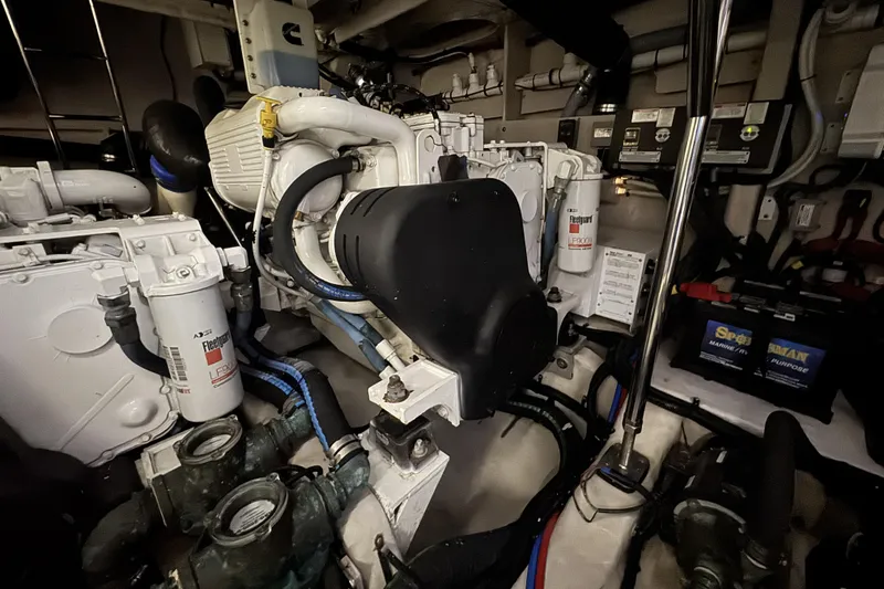 Slide: The Image of Engine room of a 2016 Sea Ray L590 Fly yacht, showcasing mechanical components and systems. - 8