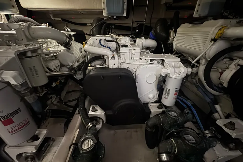 Slide: The Image of Engine room of a 2016 Sea Ray L590 Fly yacht, showcasing mechanical components. - 9