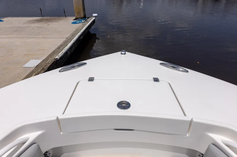 Slide: The Image of Bow of 2022 Regulator 28 boat docked at marina. - 36