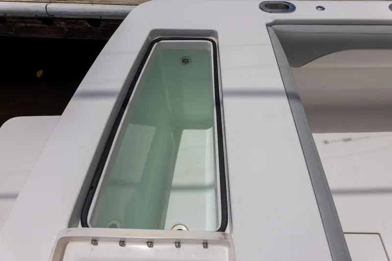 Slide: The Image of 2022 Regulator 28 boat livewell, featuring a sleek design and spacious interior. - 46