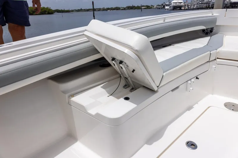 Slide: The Image of 2022 Regulator 28 boat interior with open storage compartment and seating. - 42