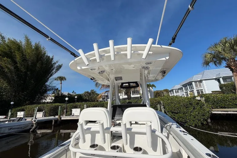 Slide: The Image of 2022 Regulator 28 boat docked, featuring a sleek design and modern amenities. - 8