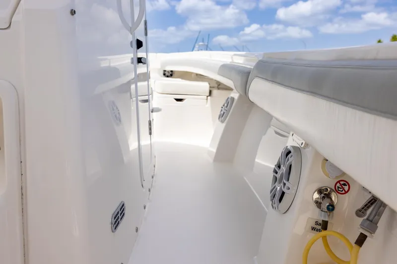 Slide: The Image of 2022 Regulator 28 boat interior with seating and marine equipment. - 25