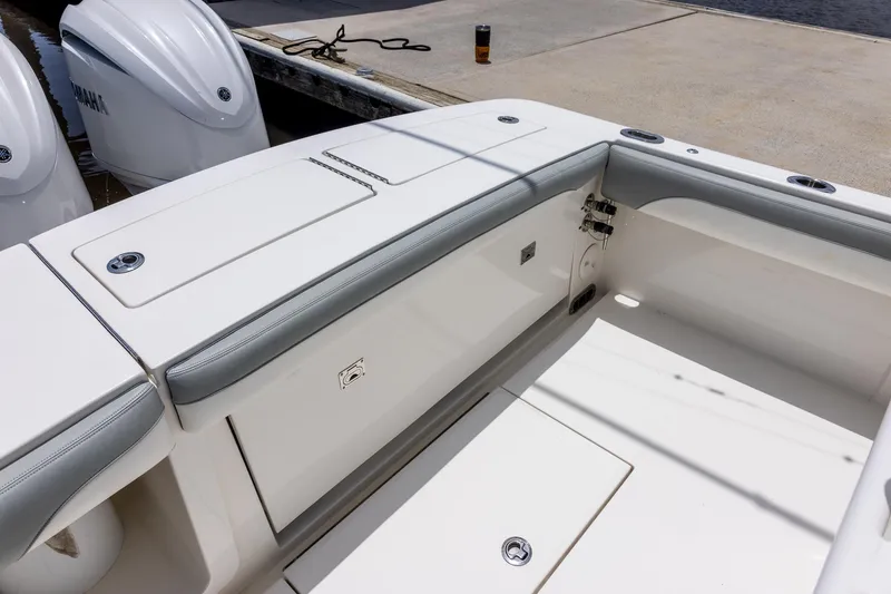 Slide: The Image of 2022 Regulator 28 boat interior with Yamaha engines, docked at marina. - 20