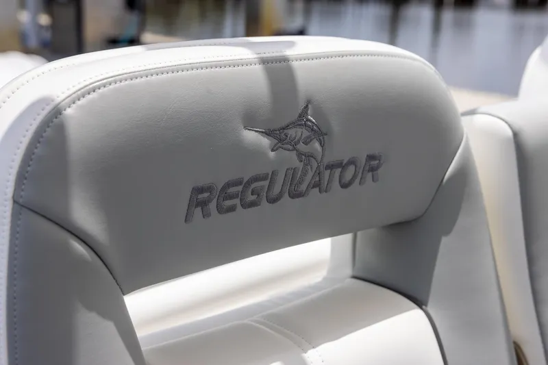Slide: The Image of 2022 Regulator 28 boat seat with embroidered logo and marlin design. - 32