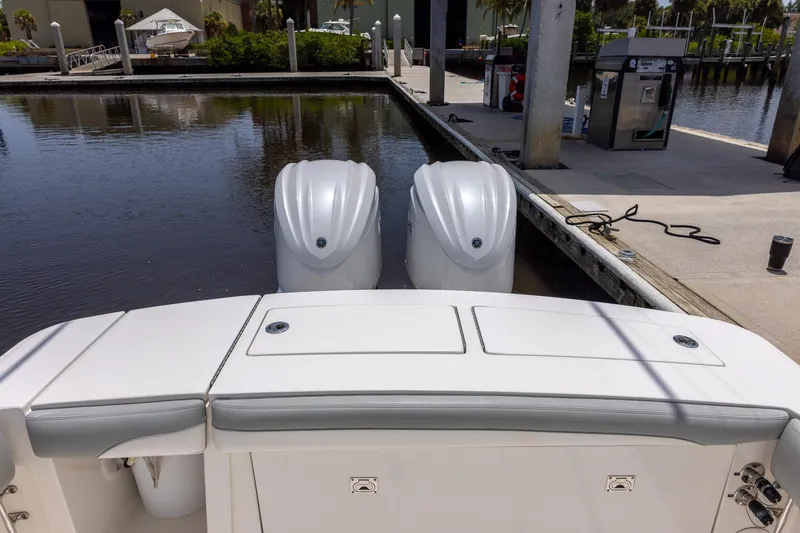 Slide: The Image of 2022 Regulator 28 boat with dual engines docked at marina. - 18