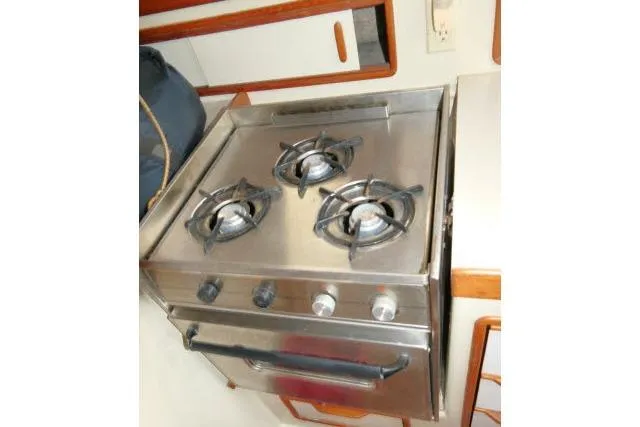 Slide: The Image of Stainless steel stove with three burners on a 1988 Irwin 38-2 yacht. - 12