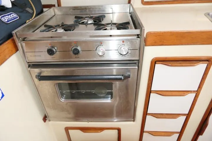 Slide: The Image of Stainless steel stove and oven in 1988 Irwin 38-2 yacht kitchen. - 13