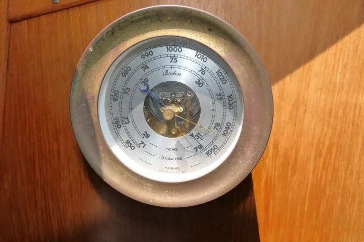 Slide: The Image of Barometer on 1988 Irwin 38-2 yacht, displaying atmospheric pressure in inches and centimeters. - 17