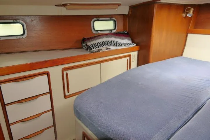 Slide: The Image of Cozy cabin interior of 1988 Irwin 38-2 sailboat with bed and storage. - 24