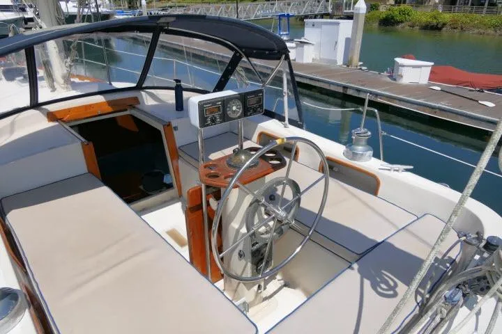Slide: The Image of Cockpit of 1988 Irwin 38-2 sailboat with steering wheel and navigation instruments. - 40