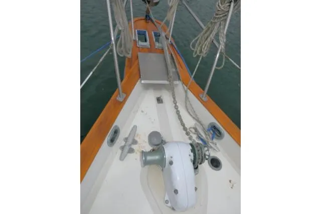 Slide: The Image of Bow of 1988 Irwin 38-2 sailboat with anchor chain and winch. - 49