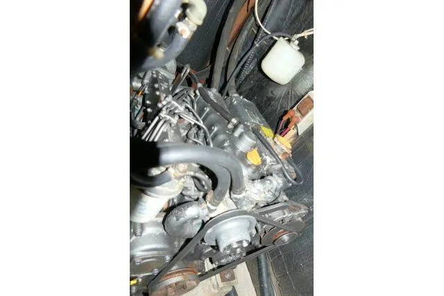 Slide: The Image of Engine compartment of a 1988 Irwin 38-2 sailboat, showing mechanical components. - 51