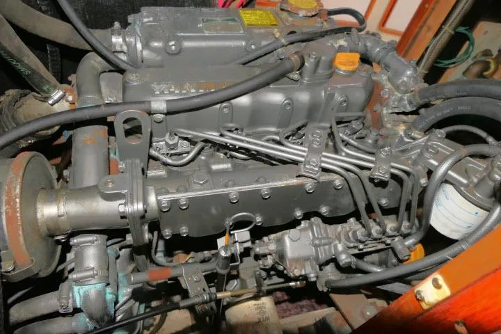 Slide: The Image of Engine of a 1988 Irwin 38-2 sailboat, showcasing intricate mechanical components and wiring. - 52