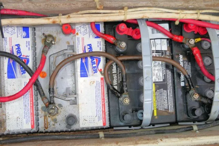 Slide: The Image of Battery compartment of a 1988 Irwin 38-2 sailboat with connected cables. - 53