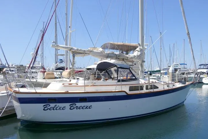 Slide: The Image of 1988 Irwin 38-2 sailboat "Belize Breeze" docked in a marina. - 57