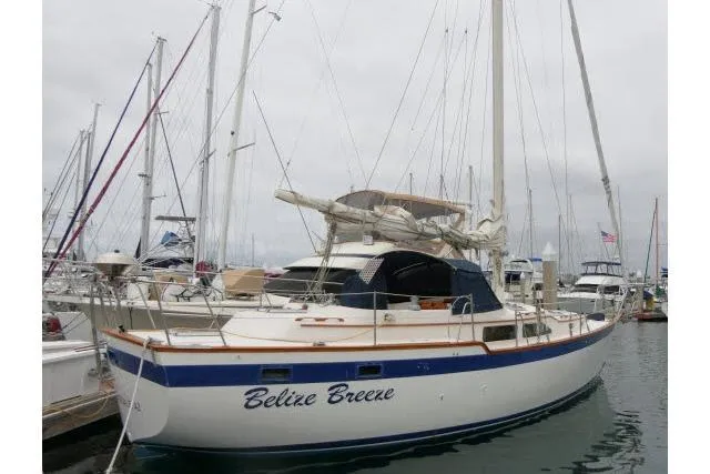 Slide: The Image of 1988 Irwin 38-2 sailboat "Belize Breeze" docked in a marina. - 58