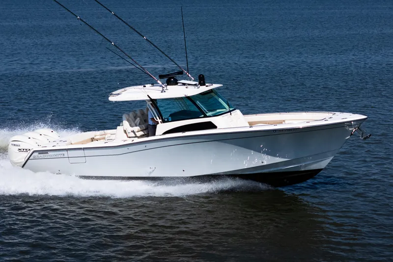 The Image of 2025 Grady-White Canyon 386 boat cruising on open water. - 0