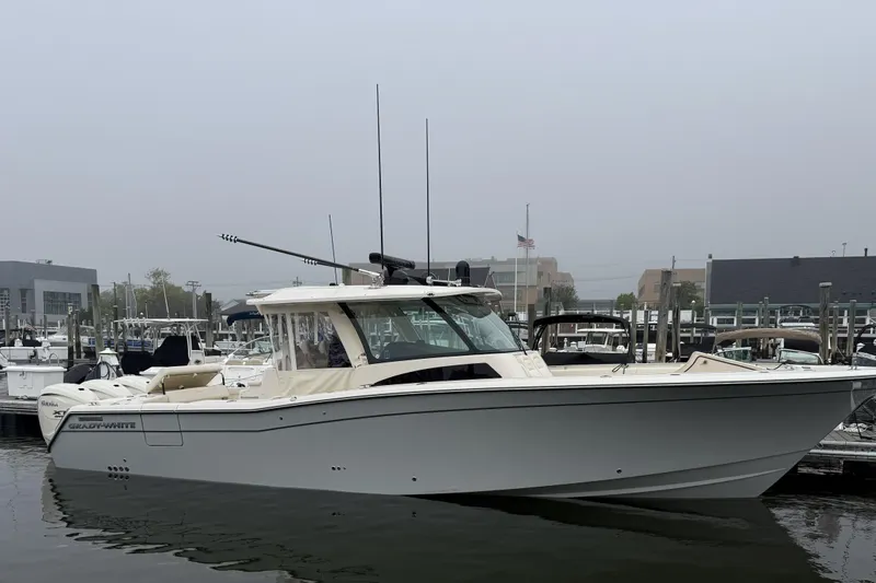 The Image of 2025 Grady-White Canyon 386 boat docked in a marina on a foggy day. - 14