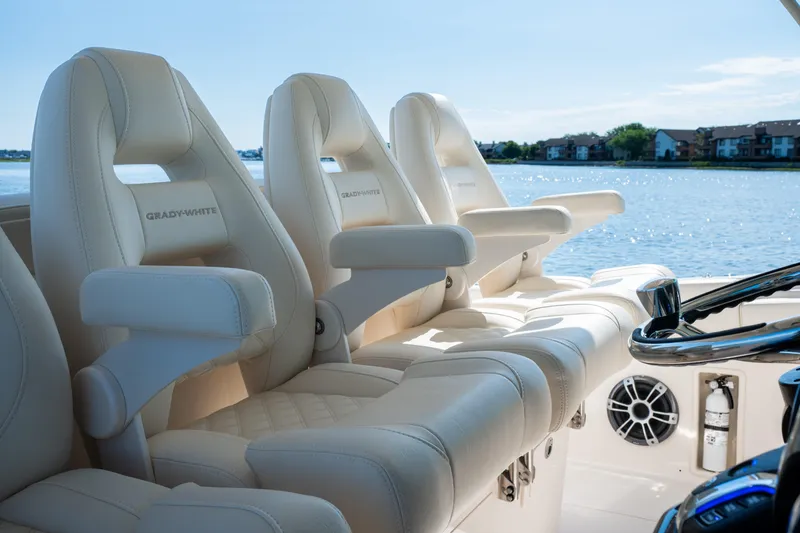 Slide: The Image of Luxurious seating on 2025 Grady-White Canyon 386 boat, overlooking serene waterfront. - 25