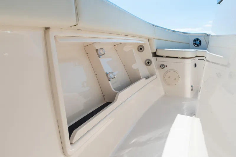 Slide: The Image of Interior view of 2025 Grady-White Canyon 386 boat, featuring storage compartments and seating. - 27