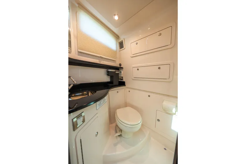 Slide: The Image of Luxurious bathroom interior of 2025 Grady-White Canyon 386 boat, featuring modern fixtures. - 30