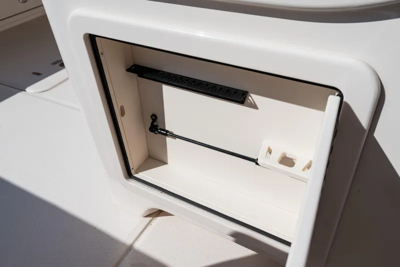Slide: The Image of Open storage compartment on 2025 Grady-White Canyon 386 boat. - 32