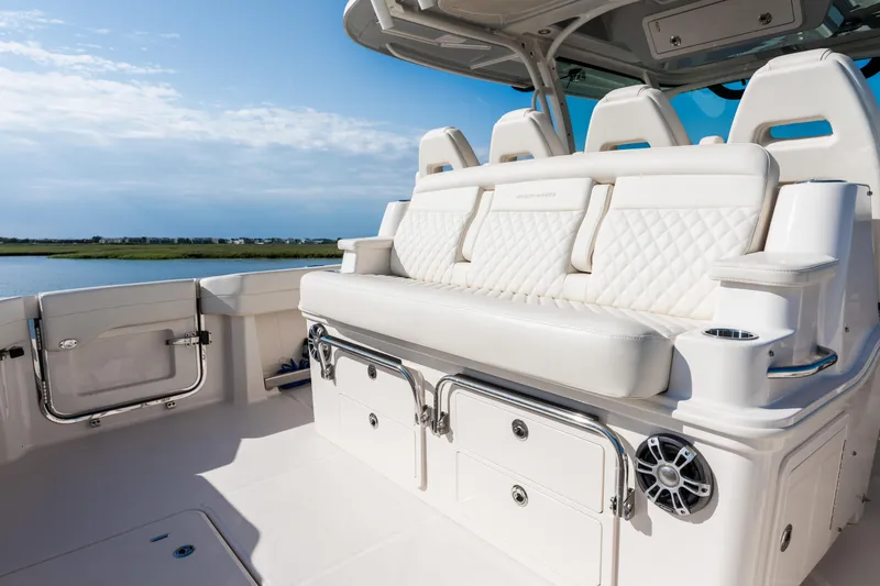 Slide: The Image of 2025 Grady-White Canyon 386 boat interior with luxurious seating and storage. - 37
