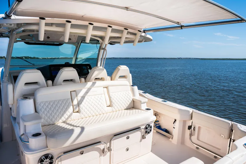 Slide: The Image of 2025 Grady-White Canyon 386 boat interior with luxurious seating on open water. - 38