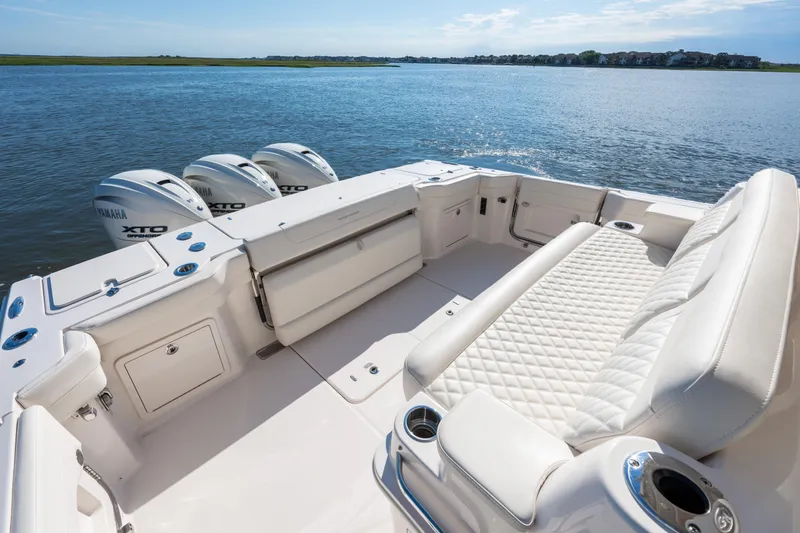 Slide: The Image of 2025 Grady-White Canyon 386 boat with Yamaha engines on calm water. - 42