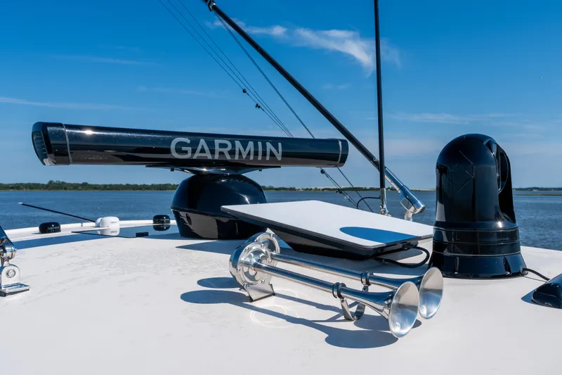 Slide: The Image of Grady-White Canyon 386 boat with Garmin radar, 2025 model, on a sunny day. - 46