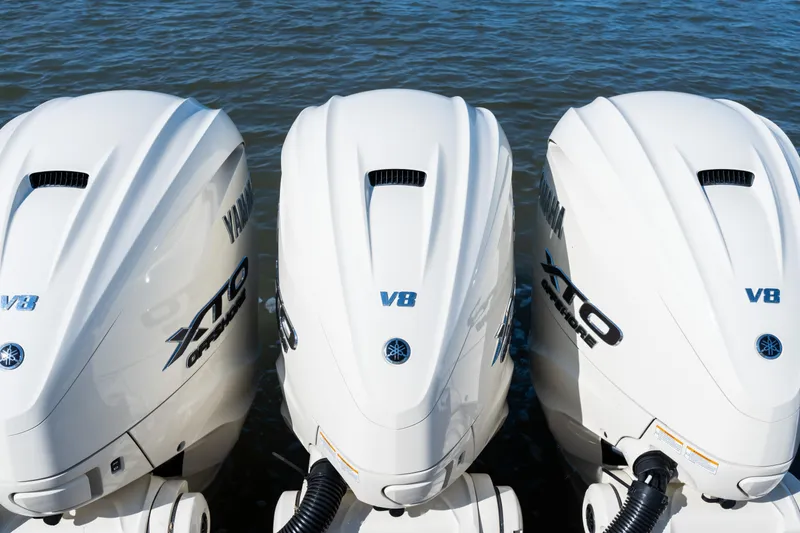 Slide: The Image of Triple Yamaha V8 outboard engines on a 2025 Grady-White Canyon 386 boat. - 47