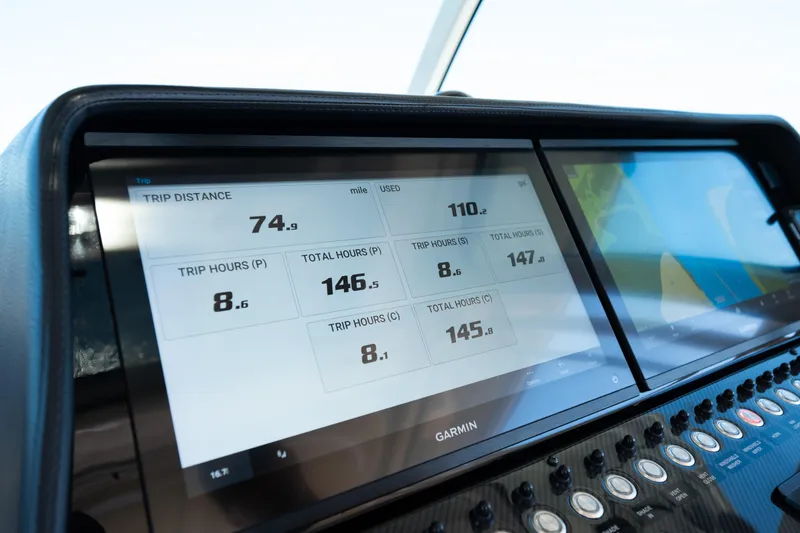 Slide: The Image of Dashboard of 2025 Grady-White Canyon 386 boat with Garmin display showing trip data. - 50