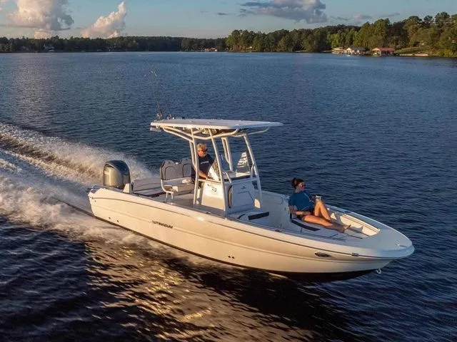 The Image of Stingray 24CC boat 2027 cruising on a serene lake at sunset. - 1