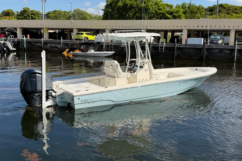 The Image of 2022 Pathfinder 2600 HPS boat docked in marina, featuring Yamaha outboard motor. - 0