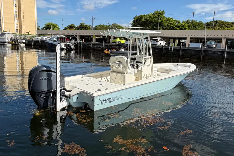 Slide: The Image of 2022 Pathfinder 2600 HPS boat with Yamaha engine docked in marina. - 1