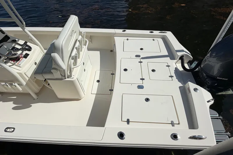 Slide: The Image of 2022 Pathfinder 2600 HPS boat deck with seating and storage compartments. - 10