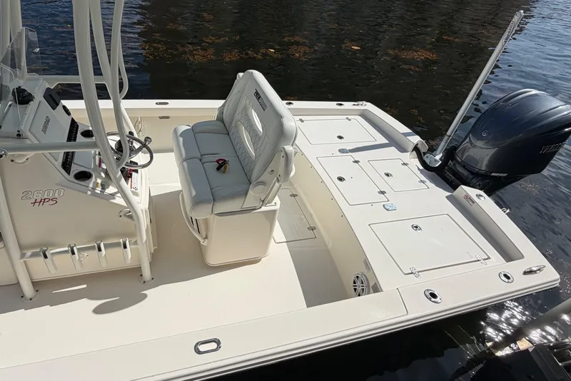 Slide: The Image of 2022 Pathfinder 2600 HPS boat interior with seating and Yamaha outboard motor. - 11