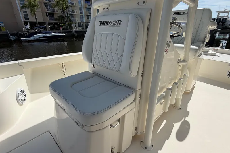 Slide: The Image of 2022 Pathfinder 2600 HPS boat interior with cushioned seating and rod holders. - 18