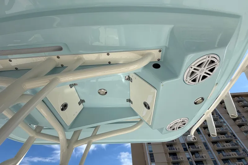 Slide: The Image of 2022 Pathfinder 2600 HPS boat underside with speakers and storage compartments. - 26
