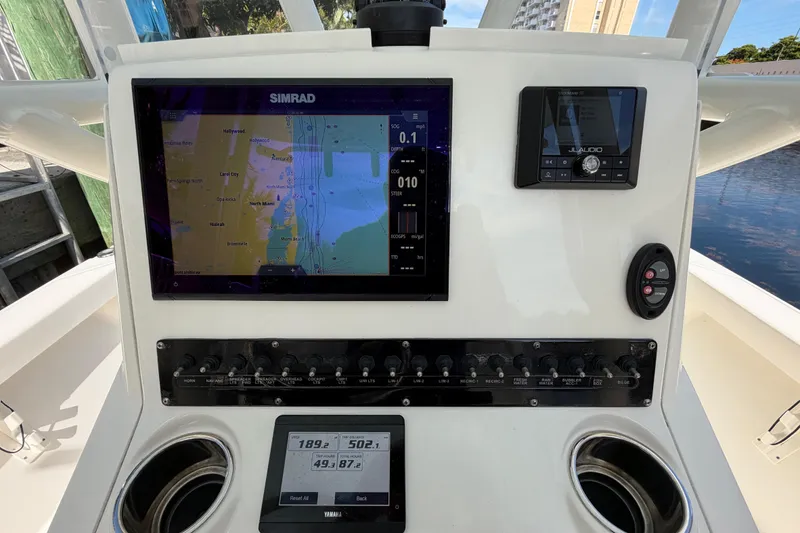 Slide: The Image of 2022 Pathfinder 2600 HPS boat dashboard with Simrad navigation and JL Audio system. - 28