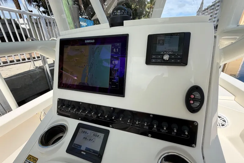 Slide: The Image of Control panel of a 2022 Pathfinder 2600 HPS boat with navigation and audio systems. - 29