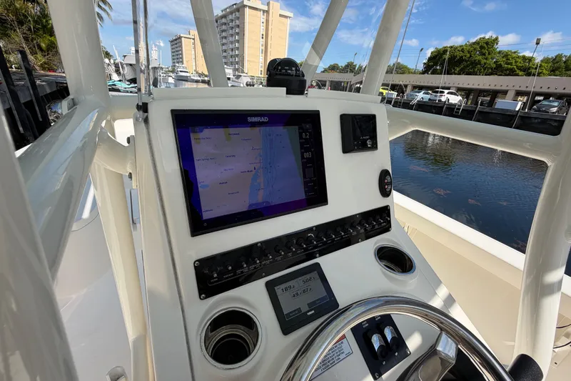 Slide: The Image of Interior view of 2022 Pathfinder 2600 HPS boat with navigation system and steering wheel. - 30