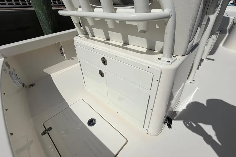 Slide: The Image of 2022 Pathfinder 2600 HPS boat interior with storage compartments and seating area. - 35